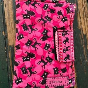 Pink and black cat book cover with a cute design